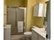Bathroom featuring a white vanity, toilet, and shower with frosted glass doors at 398 Blue Stem Dr. # 59E, Pawleys Island, SC 29585