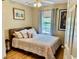 Bedroom with a queen-size bed, light walls, and lots of natural light at 398 Blue Stem Dr. # 59E, Pawleys Island, SC 29585