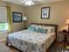 Cozy bedroom features a queen-size bed, soft lighting, and coastal decor to create a relaxing atmosphere at 398 Blue Stem Dr. # 59E, Pawleys Island, SC 29585