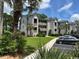 Attractive condo building with large palm trees and well-maintained landscaping and ample parking at 398 Blue Stem Dr. # 59E, Pawleys Island, SC 29585