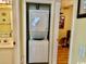 A stacked washer and dryer unit tucked into a closet off the bathroom area at 398 Blue Stem Dr. # 59E, Pawleys Island, SC 29585