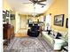 Comfortable living area with a ceiling fan, kitchen view, and decorative rug at 398 Blue Stem Dr. # 59E, Pawleys Island, SC 29585