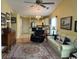 Comfortable living room with a cream-colored sofa, ceiling fan, and adjacent to a modern kitchen at 398 Blue Stem Dr. # 59E, Pawleys Island, SC 29585