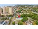 Aerial view of a multi-story building near the coast, nestled amongst trees and residential areas at 400 Hillside Dr. S, North Myrtle Beach, SC 29582