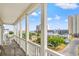 Balcony with rocking chairs offering city views and neighborhood charm at 400 Hillside Dr. S, North Myrtle Beach, SC 29582