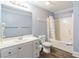 Bathroom featuring a white vanity, toilet, and a shower/tub combo with a shower curtain at 400 Hillside Dr. S, North Myrtle Beach, SC 29582
