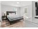 Comfortable bedroom features a bed, bedside tables, a dresser, and natural light at 400 Hillside Dr. S, North Myrtle Beach, SC 29582