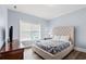 Cozy bedroom features a tufted headboard, natural light, and a relaxing atmosphere at 400 Hillside Dr. S, North Myrtle Beach, SC 29582