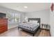 Cozy bedroom features a bed, bedside tables, a dresser, and natural light at 400 Hillside Dr. S, North Myrtle Beach, SC 29582