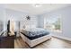 Serene bedroom with comfortable queen bed, soft lighting, and a window with neighborhood views at 400 Hillside Dr. S, North Myrtle Beach, SC 29582