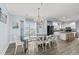The dining area shows a dark table with white chairs, and the kitchen with white cabinets at 400 Hillside Dr. S, North Myrtle Beach, SC 29582