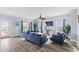 Bright living room boasts modern furnishings, wood-style floors, and view to outdoors at 400 Hillside Dr. S, North Myrtle Beach, SC 29582