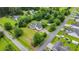 Aerial view of a charming home featuring a well-kept lawn and mature trees at 412 Carolina Dr., Loris, SC 29569
