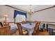 Traditional dining room features hardwood floors and a chandelier above a lace-covered table at 412 Carolina Dr., Loris, SC 29569