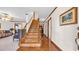 Entryway with wood flooring, staircase and trim, painting and doorways visible at 412 Carolina Dr., Loris, SC 29569
