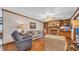 Inviting living room featuring a brick fireplace, hardwood floors, and cozy seating arrangements at 412 Carolina Dr., Loris, SC 29569