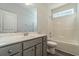 Bright bathroom featuring grey vanity with marble countertop, tile flooring and shower-tub combo at 427 Lifestyle Court, Surfside Beach, SC 29575