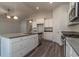 Bright kitchen features stainless steel appliances, center island with a sink, and ample cabinet space at 427 Lifestyle Court, Surfside Beach, SC 29575