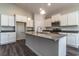 Modern kitchen boasts a center island, stainless steel appliances, and sleek countertops with ample storage at 427 Lifestyle Court, Surfside Beach, SC 29575
