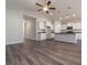 Open concept living space featuring vaulted ceilings, hardwood floors, recessed lighting, and a modern kitchen at 427 Lifestyle Court, Surfside Beach, SC 29575