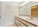 Spacious bathroom featuring a double sink vanity, large mirror, and vanity lighting at 435 Ocean Creek Dr. # 2722, Myrtle Beach, SC 29572