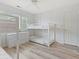 Bright bedroom with bunk beds, featuring updated flooring and a nearby closet at 435 Ocean Creek Dr. # 2722, Myrtle Beach, SC 29572