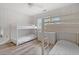 Inviting bedroom featuring twin bunk beds, dresser, and neutral decor at 435 Ocean Creek Dr. # 2722, Myrtle Beach, SC 29572
