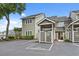 Charming townhouse with dedicated parking and well-maintained landscaping under a bright blue sky at 435 Ocean Creek Dr. # 2722, Myrtle Beach, SC 29572