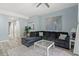 Comfortable living room with a plush gray sectional, stylish rug, and serene blue walls at 435 Ocean Creek Dr. # 2722, Myrtle Beach, SC 29572