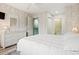 Bright main bedroom featuring neutral walls, ensuite access, and crisp white furniture at 435 Ocean Creek Dr. # 2722, Myrtle Beach, SC 29572