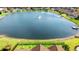 An aerial view of a lovely home backing up to a large pond with mature landscaping at 455 Hyacinth Loop, Murrells Inlet, SC 29576