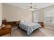 Bedroom with neutral walls and carpet with ceiling fan and two windows with blinds at 455 Hyacinth Loop, Murrells Inlet, SC 29576