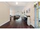 Inviting entryway leads into an open living area, showcasing hardwood floors and elegant decor at 455 Hyacinth Loop, Murrells Inlet, SC 29576