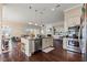Open concept kitchen with stainless steel appliances, center island and barstool seating at 455 Hyacinth Loop, Murrells Inlet, SC 29576