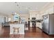 Open-concept kitchen boasts a large island, stainless steel appliances, and access to living area at 455 Hyacinth Loop, Murrells Inlet, SC 29576