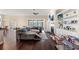 Open-concept living room with fireplace, built-in shelving, and an abundance of natural light at 455 Hyacinth Loop, Murrells Inlet, SC 29576