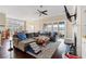 Bright living room featuring a fireplace, ceiling fan, and sliding glass doors to the outdoor patio at 455 Hyacinth Loop, Murrells Inlet, SC 29576