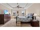 Bright, spacious bedroom with tray ceiling, ceiling fan, and view of the waterway from both windows at 455 Hyacinth Loop, Murrells Inlet, SC 29576
