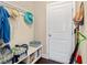 Mud room area with wood floors, hat rack, shelf and cleaning supplies at 455 Hyacinth Loop, Murrells Inlet, SC 29576