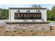Close up of the community's stone monument sign, reading 'Lakeshore' at 455 Hyacinth Loop, Murrells Inlet, SC 29576