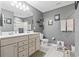 Modern bathroom with double vanity sinks, gray walls, and stylish decor at 4927 Sandlewood Dr., Myrtle Beach, SC 29579