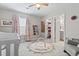 Charming Bedroom with a crib, pink curtains, closet and adjoining bathroom at 4927 Sandlewood Dr., Myrtle Beach, SC 29579