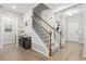Elegant entryway with hardwood floors, staircase, and stylish console table at 4927 Sandlewood Dr., Myrtle Beach, SC 29579
