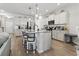 Spacious kitchen with stainless appliances, granite countertops, white cabinets, and a large center island at 4927 Sandlewood Dr., Myrtle Beach, SC 29579