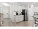 Bright kitchen features white cabinets, stainless steel refrigerator, granite countertops and modern appliances at 4927 Sandlewood Dr., Myrtle Beach, SC 29579