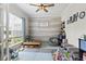 Bright playroom with large windows, natural light, wood-style wall paneling, and various toys and play areas at 4927 Sandlewood Dr., Myrtle Beach, SC 29579