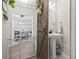 Charming powder room with a pedestal sink, barn door, and stylish decor at 4927 Sandlewood Dr., Myrtle Beach, SC 29579