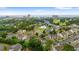 An aerial view showcasing the community's swimming pool, lush trees, landscaping, and ocean views at 503 20Th Ave. N # 55B, North Myrtle Beach, SC 29582