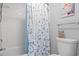 This bathroom is clean and modern with a white tile shower and calming, pale-blue walls at 503 20Th Ave. N # 55B, North Myrtle Beach, SC 29582