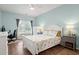 Bedroom with a white-painted bed frame, wood floors, and a ceiling fan at 503 20Th Ave. N # 55B, North Myrtle Beach, SC 29582